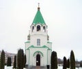 Orthodox church white walls green roof gold domes Christianity