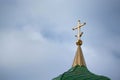 Orthodox cross with crescent at church rooftop against sky Royalty Free Stock Photo