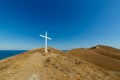 An Orthodox cross on top of a hill. Royalty Free Stock Photo