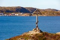 Orthodox cross on the mountain in Teriberka. Kola Peninsula, Russia