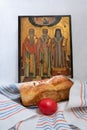 Orthodox Easter celebration with red egg, easter cake and an icone