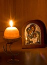 Orthodox Family icon and flaming candle Royalty Free Stock Photo