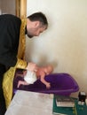 Orthodox infant baptism ceremony at home in Belarus.