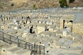 An Orthodox Jew walking around Mount of Olives Jewish Cemetery