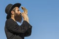 Orthodox Jewish man with a Shofar at Rosh Hashana