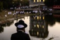 Orthodox Jewish pilgrims pray on the bank of lake near the tomb of Rabbi Nachman while celebrating Rosh Hashanah, Jewish