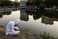 Orthodox Jewish pilgrims pray on the bank of lake near the tomb of Rabbi Nachman while celebrating Rosh Hashanah, Jewish