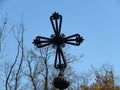 Orthodox monastery dome roof with a metal cross on the top in mountains. Century old monastery church surrounded by trees. Royalty Free Stock Photo