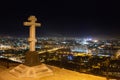 Orthodox monument and cityscape at night in winter
