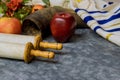 The Orthodox New Year symbols of Rosh Hashanah display a bowl of honey, a shofar, apples, and pomegranates