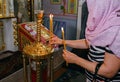 Orthodox parishioners light candles, pray for their needs Royalty Free Stock Photo