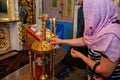 Orthodox parishioners light candles, pray for their needs Royalty Free Stock Photo