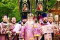 Orthodox priest in church clothes prays for Easter near temple. Religious rite, Easter celebration of Christian cathedral. Dnipro