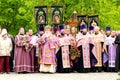 Orthodox priest in church clothes prays for Easter near temple. Religious rite, Easter celebration of Christian cathedral. Dnipro