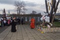 Orthodox priest makes a memorial service and people with white balloons on the day of mourning for those killed in a fire in Kemer