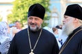 Orthodox priests in church clothes stand on the street in Kiev. A religious rite, a holiday at a Christian cathedral. Kyiv,