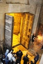 Orthodox priests and pilgrims in The Church of the Holy Sepulchre Royalty Free Stock Photo