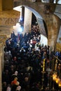Orthodox priests and pilgrims in The Church of the Holy Sepulchre Royalty Free Stock Photo