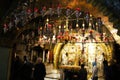 Orthodox priests and pilgrims in The Church of the Holy Sepulchre Royalty Free Stock Photo