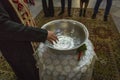 A pot of water in which the child to be baptized is immersed. Royalty Free Stock Photo