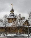 Orthodox tree Russian church covered with snow. Wooden Church Before Christmas