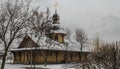 Orthodox tree Russian church covered with snow. Wooden Church Before Christmas