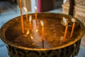 Orthodox wax Church candles illuminate the temple.