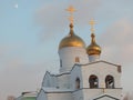 Orthodox white church with golden domes against the sky Royalty Free Stock Photo