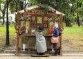 Orthodox women pray before the icons in the park.