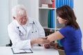 Orthopaedist diagnosing painful elbow Royalty Free Stock Photo