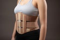 orthopedic back brace on a neutral background