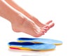 Orthopedic insoles and female legs Royalty Free Stock Photo