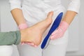 Orthopedic insoles. Fitting orthotic insoles. Flatfoot treatment. Podiatry clinic Royalty Free Stock Photo