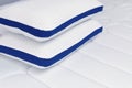 Orthopedic pillow on the quilted mattress. Comfortable bed for sleep and rest