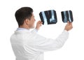 Orthopedist holding X-ray pictures on background Royalty Free Stock Photo