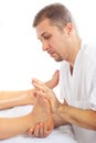 Orthopedist man massaging foot