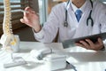 Orthopedist uses tablet at workplace