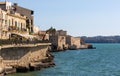 Ortigia island of Syracuse old town shore at Ionian sea along Lungomare Alfeo and Castello Maniace fortress in Sicily in Italy