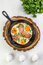 ortioned baked eggs in ceramic cocotte with Different delicious egg recipes Royalty Free Stock Photo