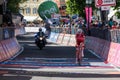 Ortisei, Italy May 25, 2017: Professional Cyclist exhausted passes the finish line in Ortisei