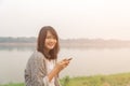 Ortrait upset sad skeptical happy serious woman talking texting on phone displeased with conversation park outdoors bac Royalty Free Stock Photo