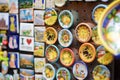 ORVIETO, ITALY - JUNE 11, 2019: Magnets sold in Orvieto, a medieval hill town, rising above the almost-vertical faces of tuff