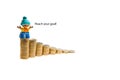 Group of Lego mini figure building a tower of coins. Save a money. Lego is a popular line of Royalty Free Stock Photo