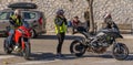 Masked and unmasked traveling bikers who stop to eat in Italian Borgo Orvinio during second wave of coronavirus Covid19, Italy