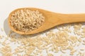 Whole Chinese Rice seed. Healthy grains on a wooden spoon. Whit Royalty Free Stock Photo