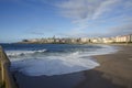 Orzan beach with strong waves and water with foam