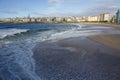 Orzan beach with strong waves and water with foam