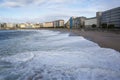 Orzan beach with strong waves and water with foam