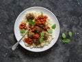 Orzo pasta with meatballs and tomato sauce on dark background, top view Royalty Free Stock Photo