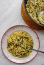 Orzo pasta vith green vegetables. Vegetarian creamy orzo cooked rissoto style Royalty Free Stock Photo